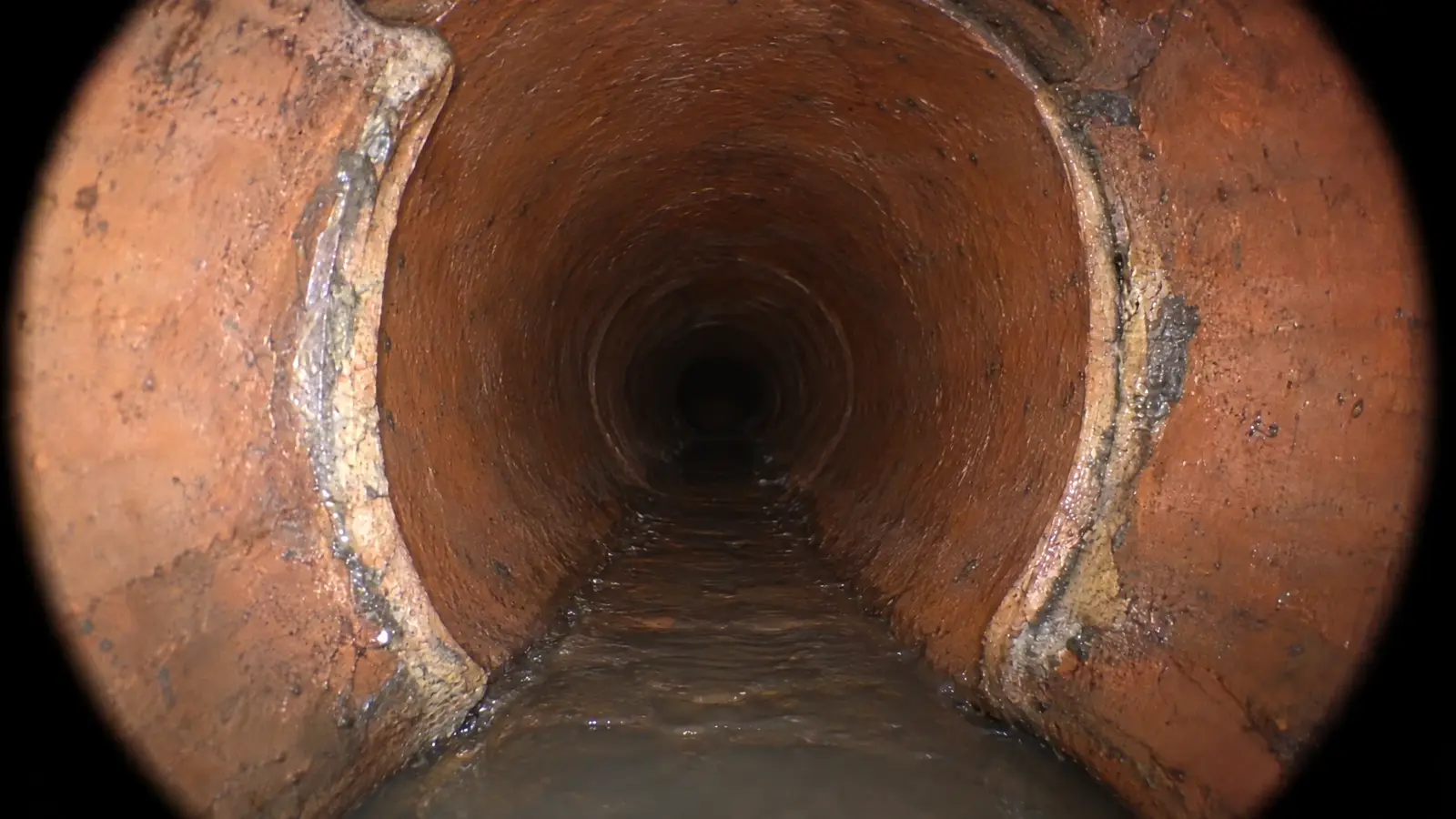 After: Root removal | Music City Drain After: a clay sewer pipe joint with an open, clear pipe